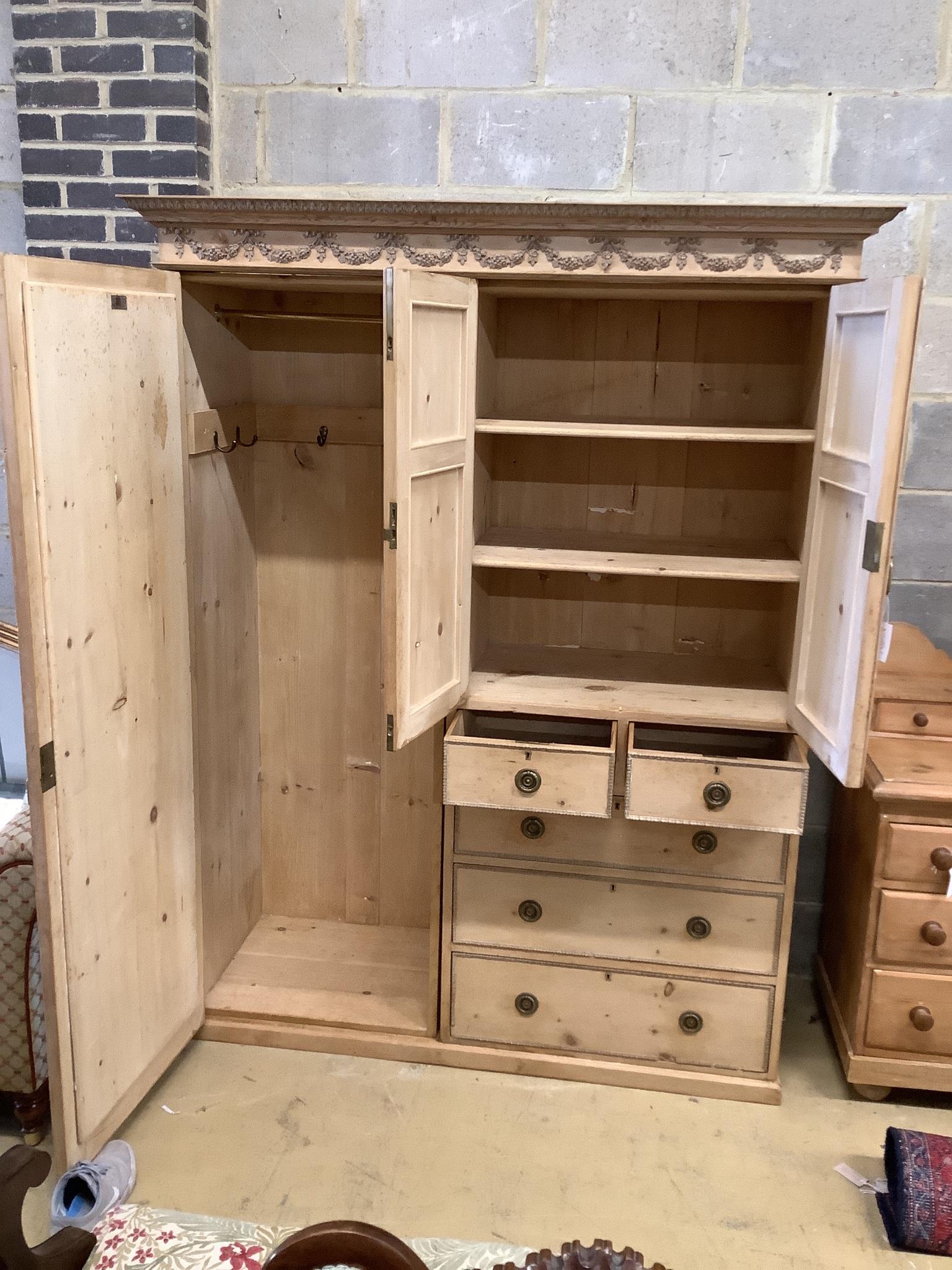 An Edwardian pine compactum wardrobe retailed by Maple & Co., length 113cm, depth 60cm, height 196cm